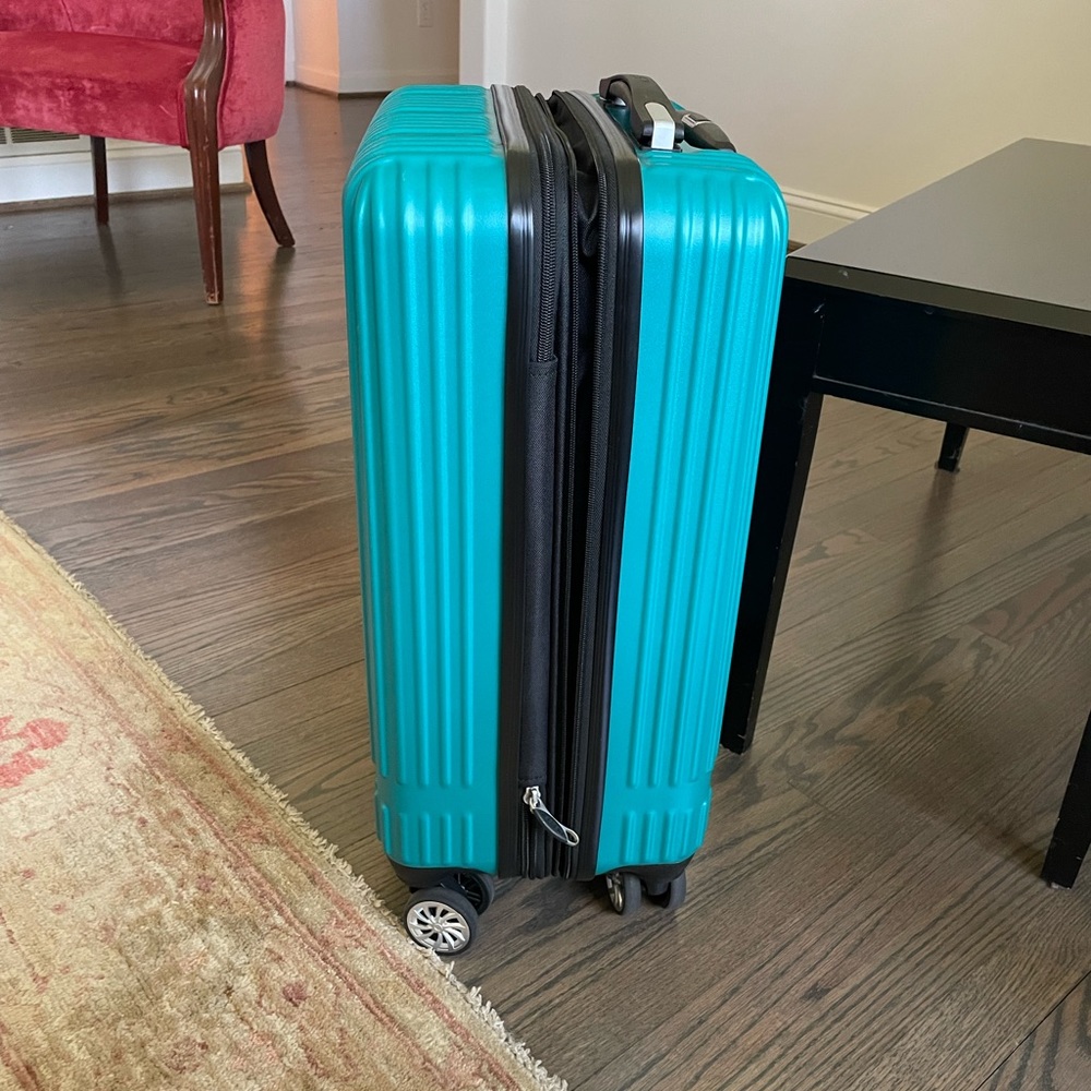 Delsey Paris roll away carry on luggage